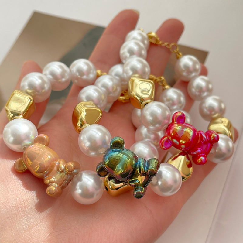 Pulsera Perlas Blancas Oso Rojo Tornasol  1W7