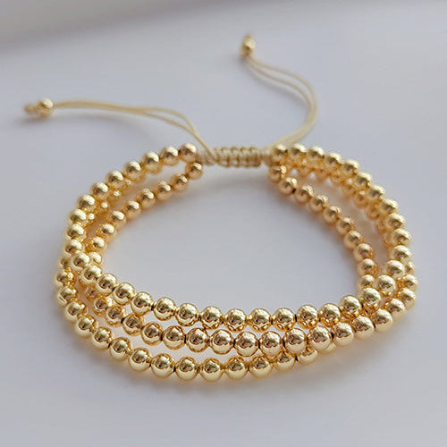 Pulsera de 3 piezas Doradas Trenzadas Bolitas  1Y2