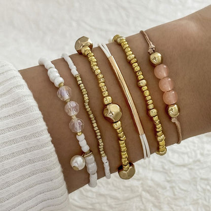 Set 6 pulseras Blancas y Doradas 1xx1