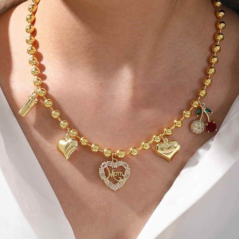 Collar Dorado Bolitas y Charms
