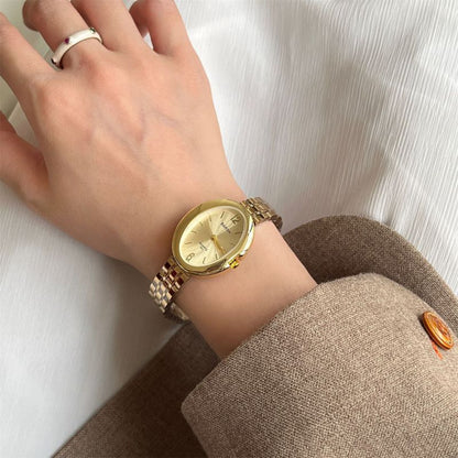 Reloj Dorado Ovalado 3i6