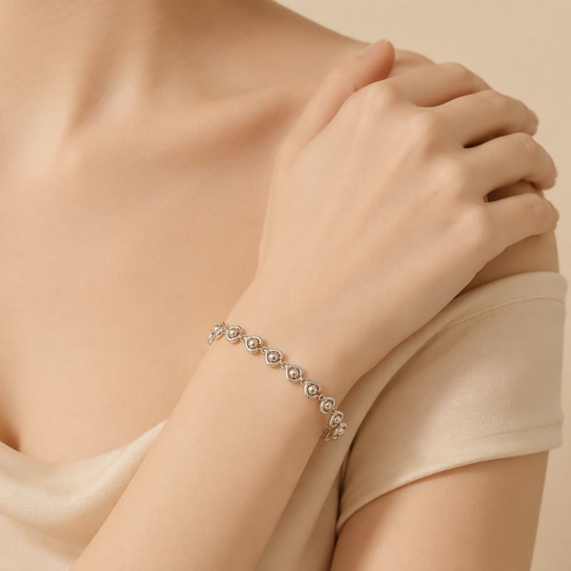 Pulsera Plateada Corazon de Perlitas