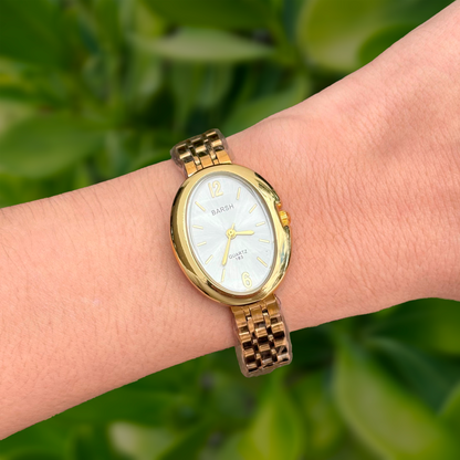 Reloj Dorado Ovalado 3i6