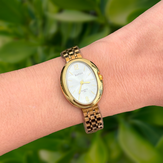 Reloj Dorado Ovalado 3i6