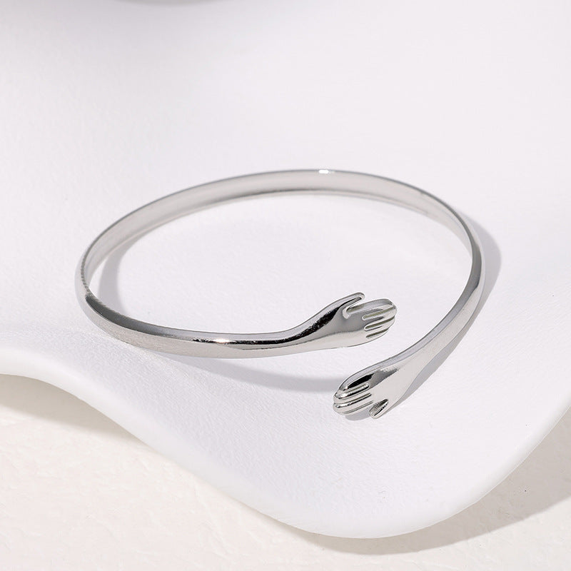 Pulsera Plateada Abrazo Acero Inoxidable  1s2