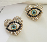 Aretes Ojo Corazon 1i3